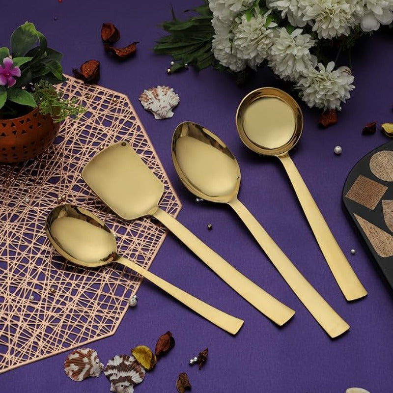 Alexa gold serving spoon set of 4 pieces on purple background with white flowers and decorative placemats