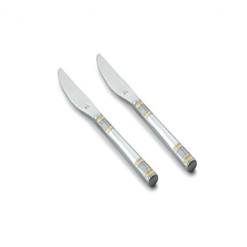 Two FnS Celebration dinner knives with polished stainless steel blades and elegant silver handles with gold decorative bands on white background.