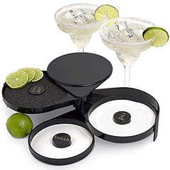 Open cocktail rimmer with salt and sugar compartments, two margaritas with lime garnish, and fresh limes