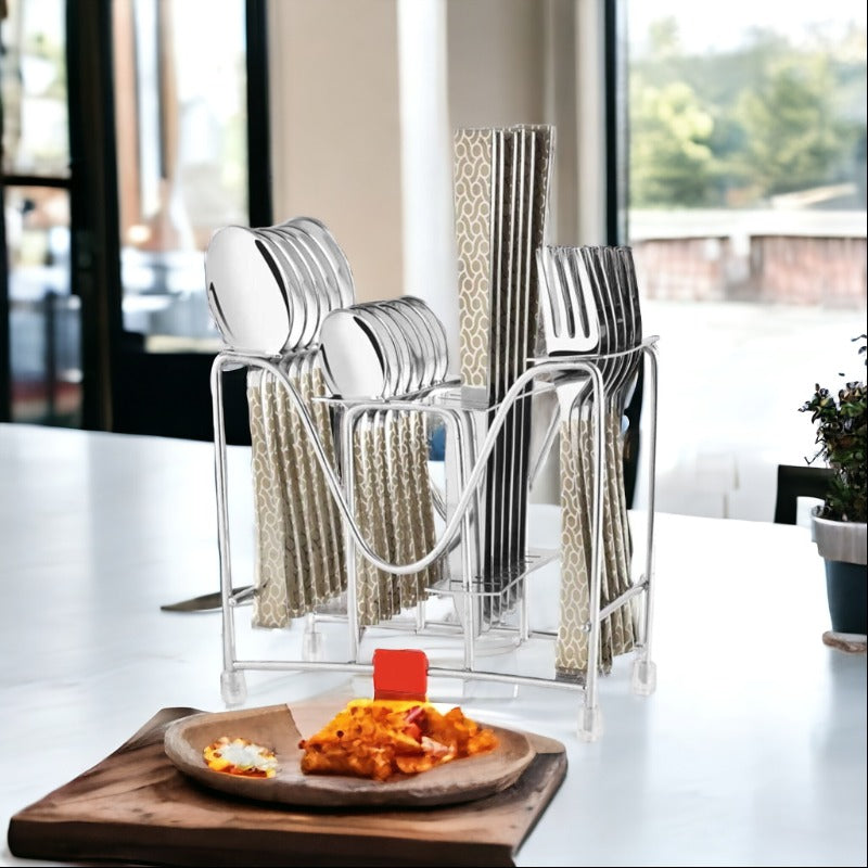 Elegant 24-piece cutlery set in patterned handles, organized in stand, styled on modern counter.
