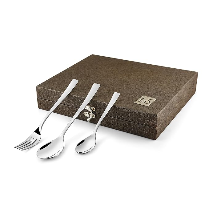 Minimalist three-piece cutlery set in a brown textured box, including fork, spoon, and teaspoon.