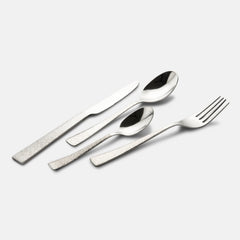 Four-piece cutlery set laid diagonally, showcasing engraved handles and polished silver finish.
