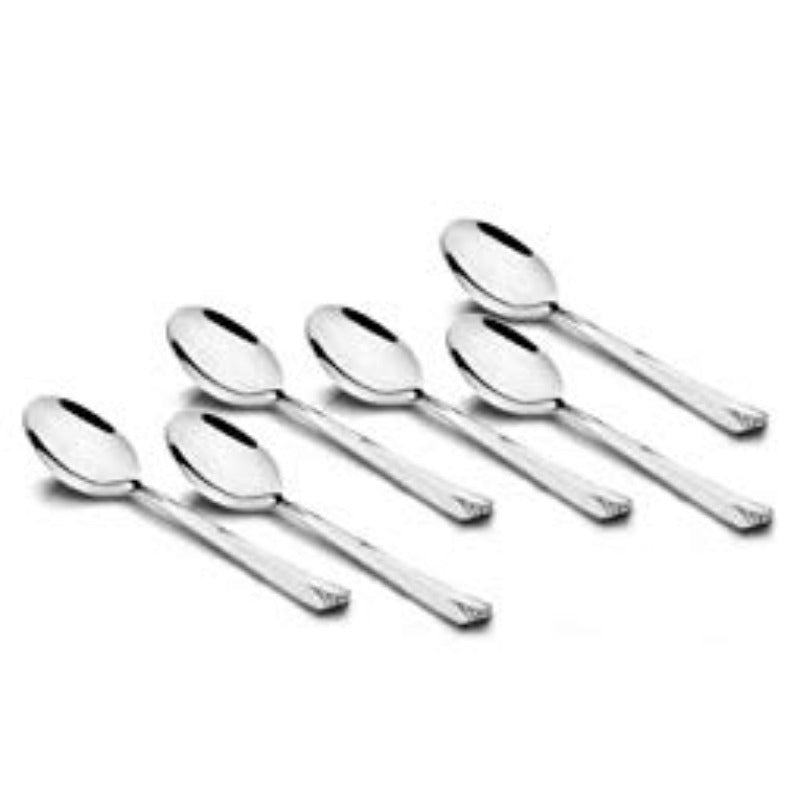 Six Divine stainless steel dinner spoons with decorative handles arranged in fan pattern on white background