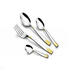 Close-up of four stainless steel utensils with intricate gold detailing on handles, isolated on white.