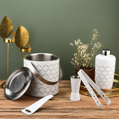 FNS 5-piece bar tool set in white with diamond pattern displayed on wooden table with gold decor and green wall