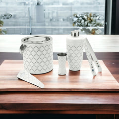 FNS 5-piece white bar tool set arranged on wooden serving board in modern home setting