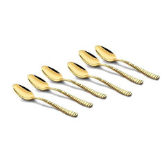FNS Boston 6-piece stainless steel gold dessert spoon set arranged artistically, featuring ribbed handles and luxurious mirror gold finish for premium dining.