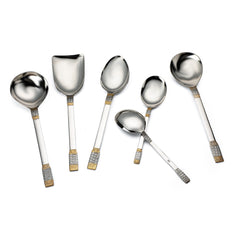 FNS Celebration serving spoon set artistically arranged showing various bowl sizes including gravy ladle, vegetable server, and spoons with elegant gold-plated textured handles.