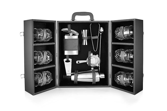 FNS Cheers Cabinet stainless steel bar tools and crystal glasses arranged on dark countertop with cocktails