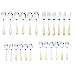 Styled table setting with three gold-handled spoons and one fork on a white plate, accompanied by mushrooms in a bowl and chocolate pieces on black fabric.