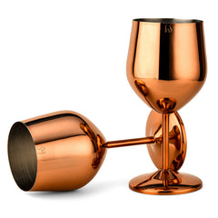 Two rose gold-finish stainless steel wine goblets on a white background, one standing upright and one tilted on its side revealing the brushed steel interior, both bearing the FNS logo.