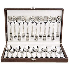 24-piece cutlery set with ornate handles displayed in elegant open brown case with secure interior straps.