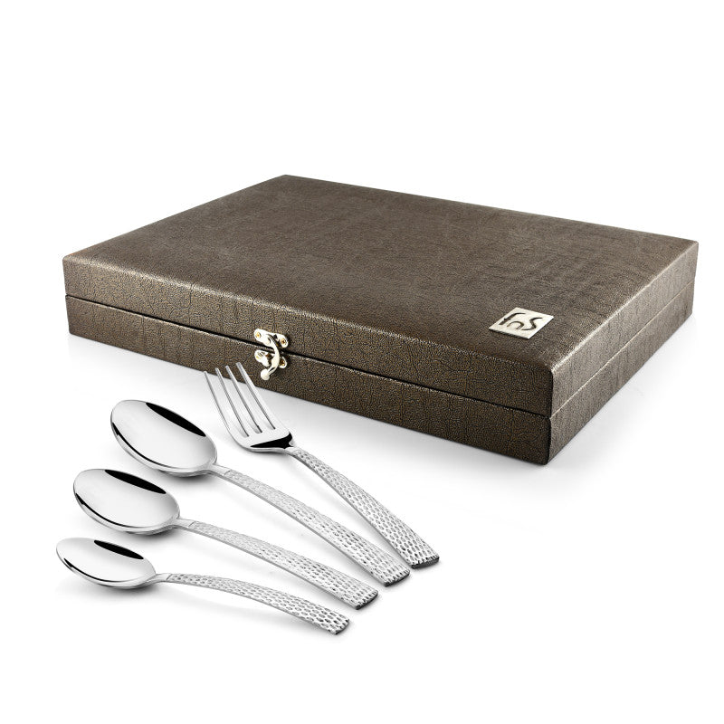 Textured brown gift box with four polished utensils—fork and three spoons—displayed in front.