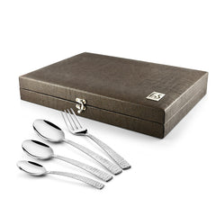 Textured brown gift box with four polished utensils—fork and three spoons—displayed in front.