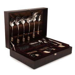 Luxury cutlery collection in polished gold-accented steel, neatly arranged in velvet-lined wooden presentation box.