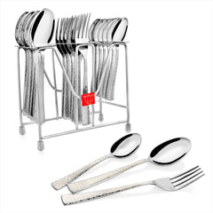 Full view of stainless steel set in stand with three separate pieces highlighting detailed handle patterns.