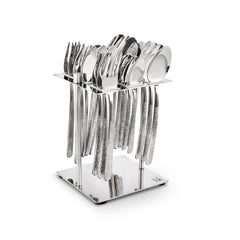 Stainless steel cutlery set with dimple-textured handles, organized upright on sleek square metallic stand.