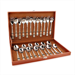 FNS 24-piece cutlery set with patterned handles arranged in open brown leatherette gift box.