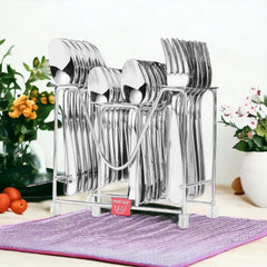 Stainless steel Montavo cutlery set in a rack on table with flowers and fruits in background.