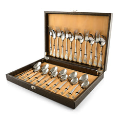 Luxurious gold-detailed cutlery set neatly arranged in a brown presentation box with satin interior.