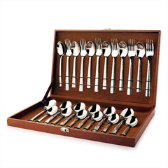 24-piece silver cutlery set with textured handles neatly arranged inside an open brown storage box.