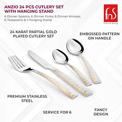 Close-up of knife, fork, and spoons showing 24K gold plating, stainless steel, and decorative embossed pattern.