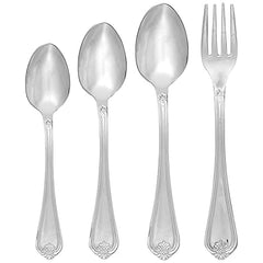 Four-piece stainless steel cutlery set featuring embossed floral handles on clean white background.