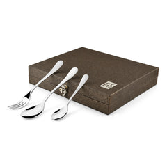 Three-piece cutlery set resting on elegant brown textured box with metallic FnS branding label.