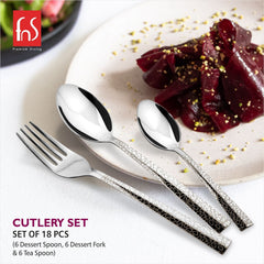 Textured-handle cutlery set placed beside gourmet dessert plate, presented for premium dining aesthetics.