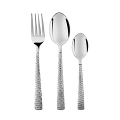 Close-up of three-piece stainless steel cutlery set with hammered handles, standing upright on white background.