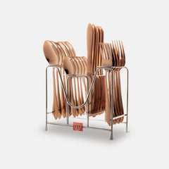 Complete rose gold cutlery set neatly arranged in metal stand, isolated on clean white background.