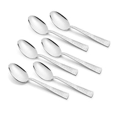Set of six stainless steel spoons with textured handles, symmetrically arranged on white surface.