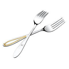 Two crossed dinner forks with gold-accented handles, highlighting premium stainless steel construction and elegant dining designRetry