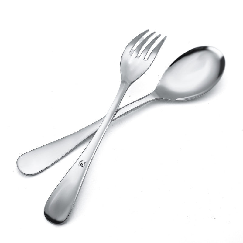 Close-up of shiny stainless steel spoon and fork crossed, showing elegant curved handles and polish.