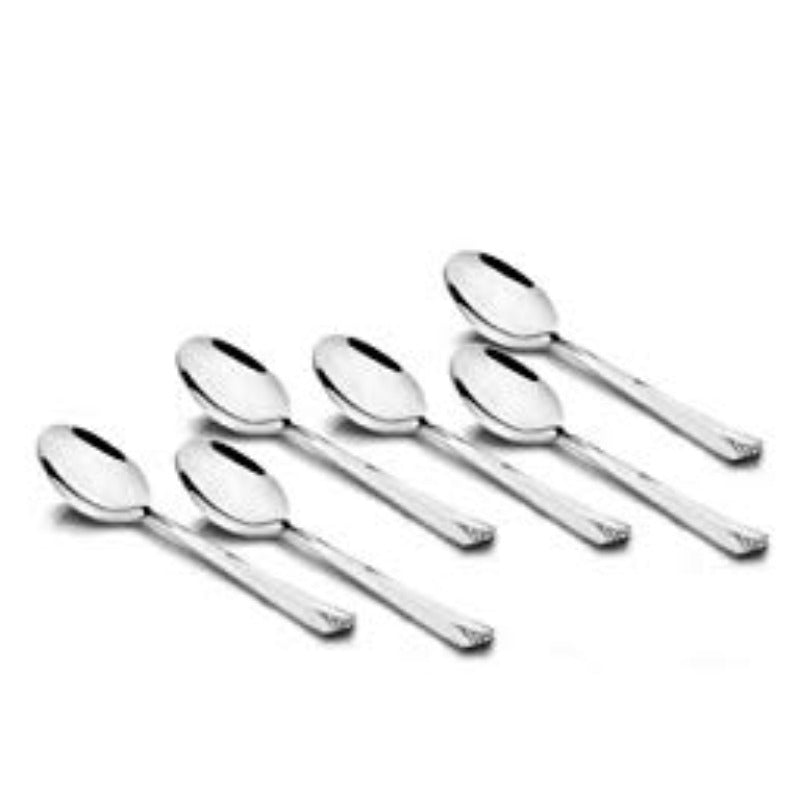 Six mirror-polished stainless steel teaspoons with sleek tapered handles featuring decorative notched tips arranged in fan formation on white background