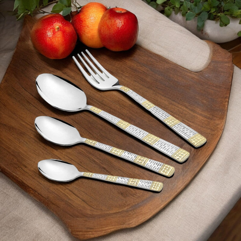 Dinner spoon, teaspoon, baby spoon, and dinner fork with engraved two-tone handles on white surface.