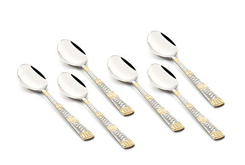 Six stainless steel teaspoons with decorative dual-tone gold and silver handles, arranged side-by-side.