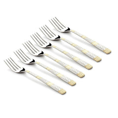 Clean product image of six identical FNS Dorian dinner forks with silver and gold patterned handles, arranged in a row on a white background.