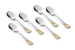 Set of six polished stainless steel tablespoons featuring gold and silver embossed handle designs.