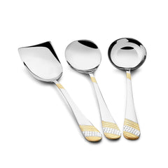 FNS Imperio rice server, gravy ladle, and large serving spoon arranged horizontally, showcasing gold-plated textured handles and mirror finish stainless steel construction.