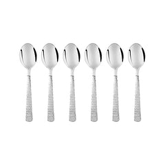Six piece FNS Madrid baby spoon set featuring mirror finish stainless steel bowls with elegant hammered texture handles arranged in row on white