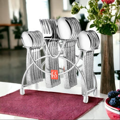 Textured-handle cutlery set neatly arranged in a chrome stand, placed on a dining table with flowers.