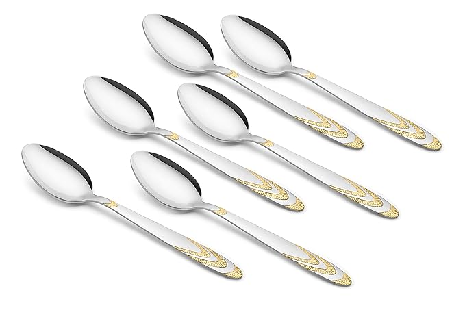 Set of six elegant teaspoons with mirror-finish bowls and decorative gold-tone handles displayed in two rows on white background, showing matching design.