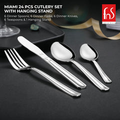 Four pieces of Miami cutlery set displayed on dark surface: fork, knife, dinner spoon, teaspoon