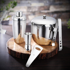 FNS Premium Dining 5-piece bar tool set with ice bucket, cocktail shaker, jigger, tongs, and bottle opener on dark wood surface