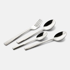 Knife, fork, and two spoons with engraved silver handles placed neatly on a plain grey background.