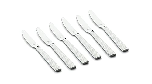 Six mirror-finished dinner knives featuring stylish textured handles laid out on a plain surface.