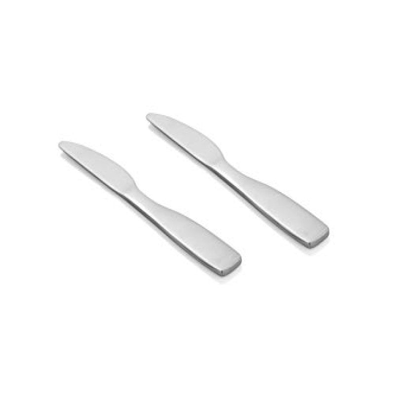 Two polished stainless steel Rio dinner knives with serrated edges and curved handles, arranged diagonally on clean white background.