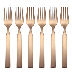 Six copper-colored dinner forks arranged in row on white background
