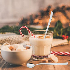 FNS Slim Line long drink spoon serving creamy holiday eggnog with candy cane decoration and festive bokeh lights, perfect for seasonal beverages and entertaining.